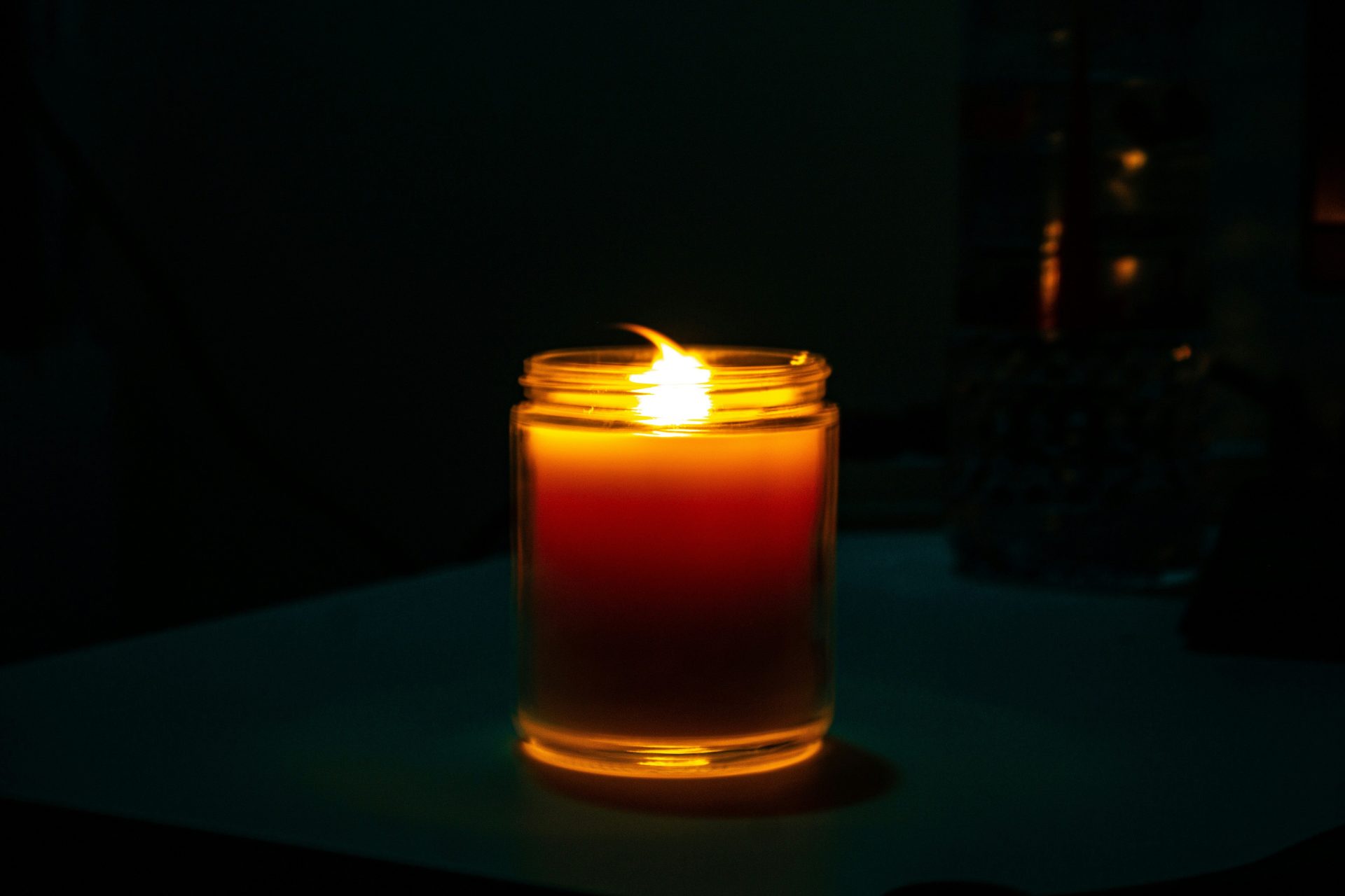 a candle in a glass